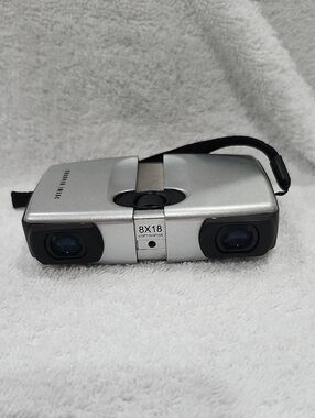 SHARPER IMAGE COMPACT 8x18 SILVER/BLACK FOLDING BINOCULARS